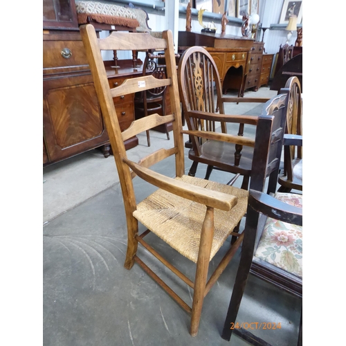 2168 - An oak ladder back rush seated chair