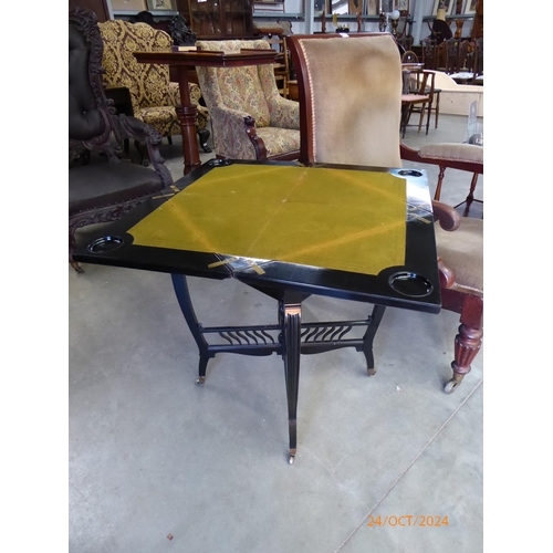 2180 - A 19th Century ebony and coramandel envelope games table