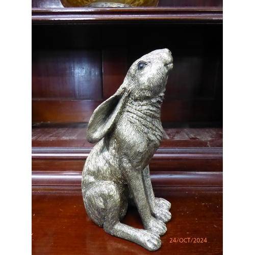 2207 - A resin bronze hare moongazing