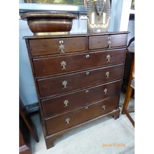 2209 - A Georgian oak two over four drawer chest of drawers with brass handles