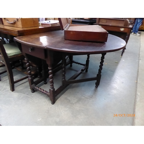 2216 - A 19th Century oak barley twist gateleg table