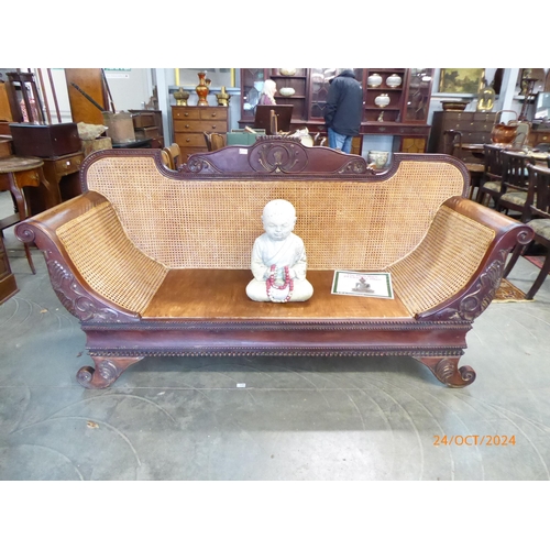 2222 - An Empire revival hardwood and cane double scroll-end sofa