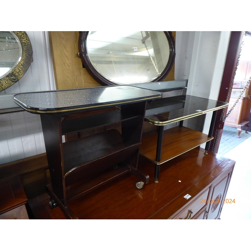 2413 - An Italian 1950's magazine rack table on wheels with another mid Century coffee table