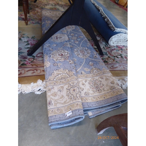 2448 - A blue pattern rug