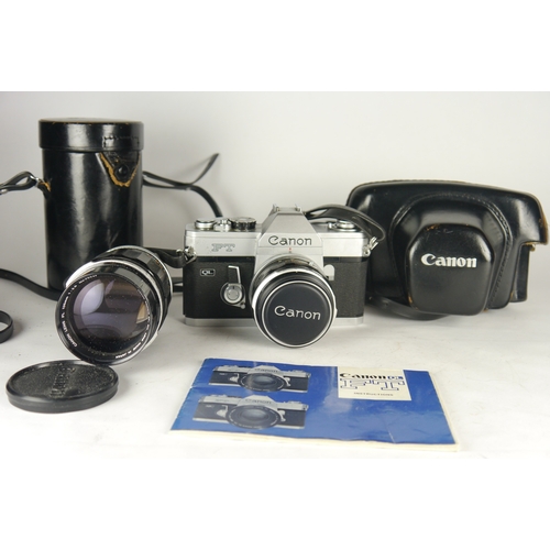 6049 - A Canon FT QL 35mm film camera w/ two Canon Camara Co lenses 50mm & 135mm