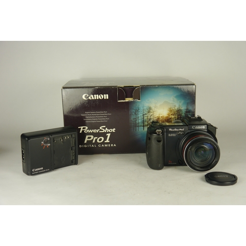 6054 - A Canon Powershot Pro1 8.0MP Digital Bridge Camera in original box with accessories