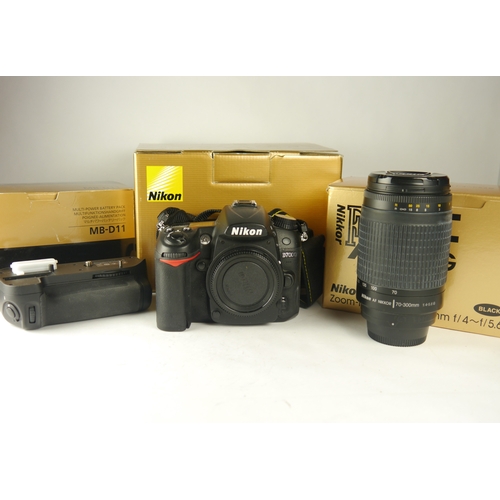 6069 - A Nikon D7000 DSLR camera w/n=Nikon AF Nikkor 70-300mm 1:4-5.6g zoom lens & Nikon MB-D11 motordrive.... 