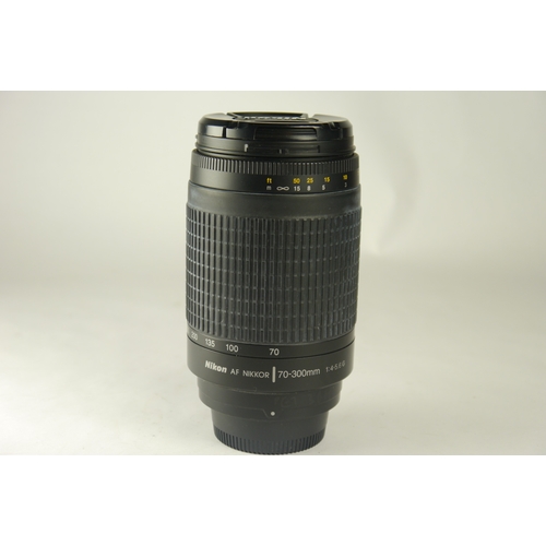 6069 - A Nikon D7000 DSLR camera w/n=Nikon AF Nikkor 70-300mm 1:4-5.6g zoom lens & Nikon MB-D11 motordrive.... 