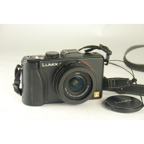 6077 - A Panasonic Lumix DMC-LX5 10MP Compact Digital Camera w/ Panasonic DE-A82 battery charger