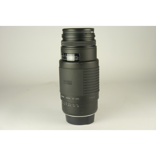 6088 - A Canon EOS 1000F 35mm SLR w/Canon Zoom lens EF 35-80mm F4-5.6 & Sigma 75-300mm f/4.5-5.6 Zoom Lens ... 