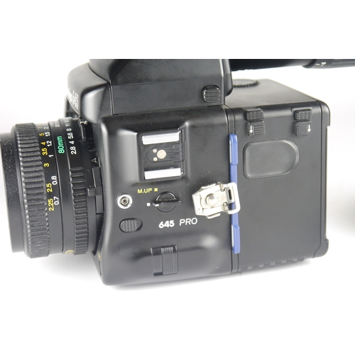 6004 - A Mamiya 645 Pro TL Medium Format 120 film camera w/ Mamiya AE Metered Prism Finder FK402 & Power Dr... 