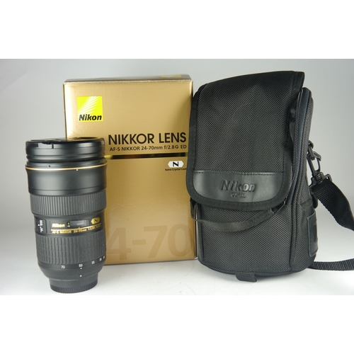 6008 - A Nikon AF-S Nikkor 24-70mm 2.8g ED lens w/ Nikon HB-40 lens hood. Comes in original box