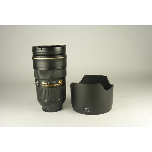 6008 - A Nikon AF-S Nikkor 24-70mm 2.8g ED lens w/ Nikon HB-40 lens hood. Comes in original box