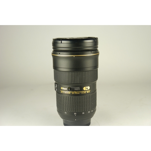 6008 - A Nikon AF-S Nikkor 24-70mm 2.8g ED lens w/ Nikon HB-40 lens hood. Comes in original box