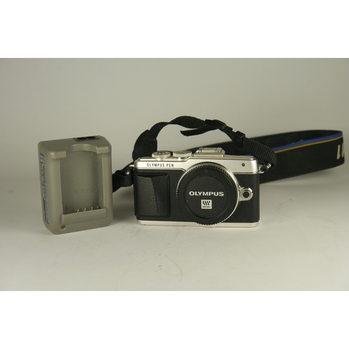 6010 - A Olympus Pen Lite E-PL7 Digital Camera, body only & charger