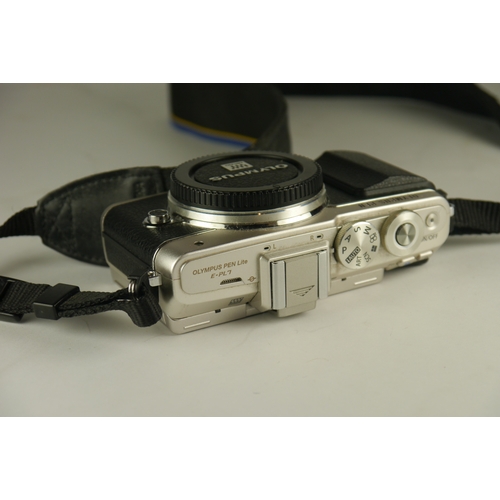 6010 - A Olympus Pen Lite E-PL7 Digital Camera, body only & charger