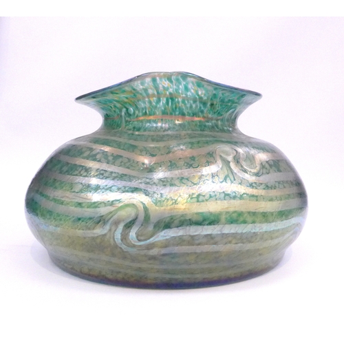 7267 - A large iridescent mottled green glass vase with waved rim. 22cm high x 34cm diameter