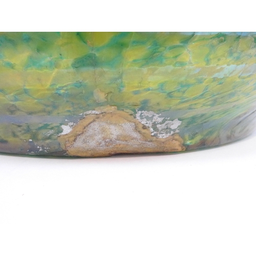 7267 - A large iridescent mottled green glass vase with waved rim. 22cm high x 34cm diameter