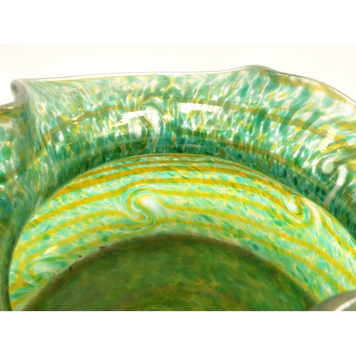 7267 - A large iridescent mottled green glass vase with waved rim. 22cm high x 34cm diameter