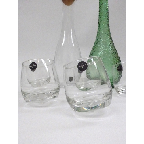 7266 - A green Italian Empoli Genie bottle and stopper, a Sagaform clear glass carafe with ball stopper and... 