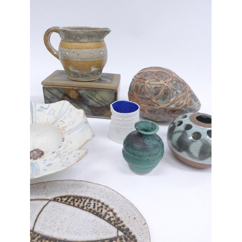 7044 - A collection of studio pottery including a Jane Allen bowl, lidded box, egg shaped sculpture, decora... 