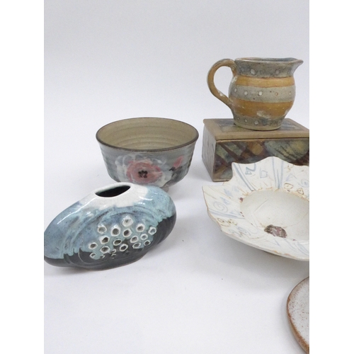 7044 - A collection of studio pottery including a Jane Allen bowl, lidded box, egg shaped sculpture, decora... 