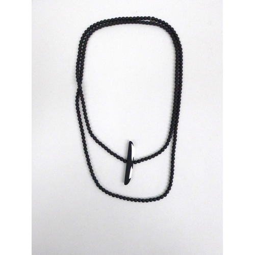 7362 - Marina and Susanna Sent murano black glass bead necklace with black and white abstract centrepiece