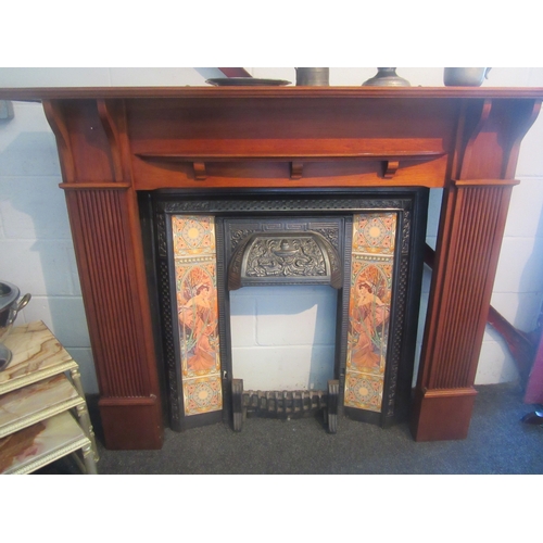 1009 - A fire place with a cast iron and tiled Art Nouveau influence surround, fire place 118cm tall x 150c... 