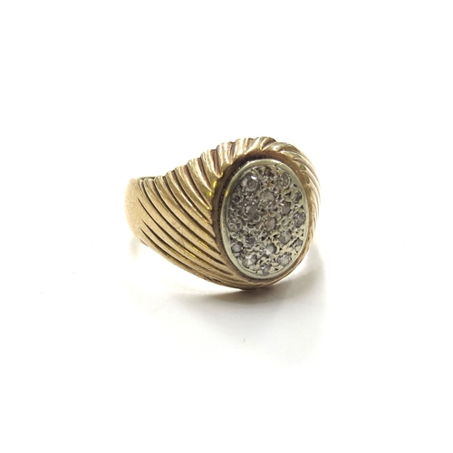 9170 - A 9ct gold gents signet ring with oval diamond encrusted centre, shaped shoulders. Size U, 8.5g