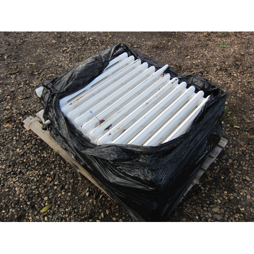 3420 - A pallet containing three reclaimed cast iron radiators