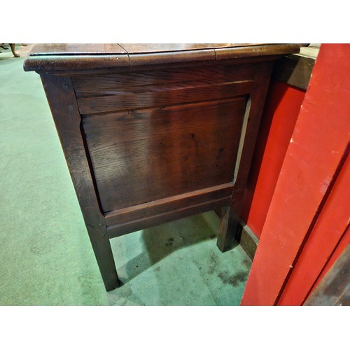 4009 - A circa 1780 pegged joined oak coffer, the split ring hinged top with internal candle/taper box over... 