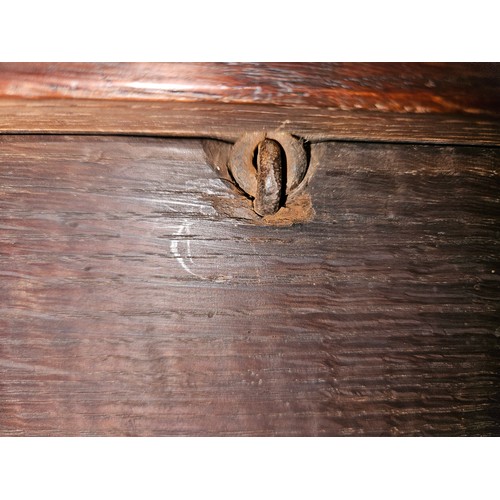 4009 - A circa 1780 pegged joined oak coffer, the split ring hinged top with internal candle/taper box over... 