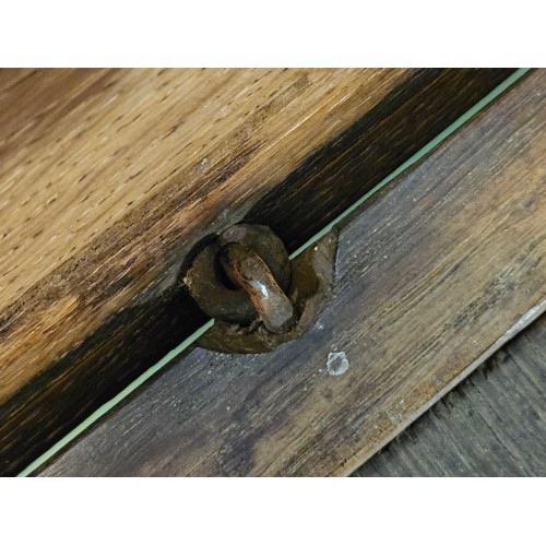 4009 - A circa 1780 pegged joined oak coffer, the split ring hinged top with internal candle/taper box over... 