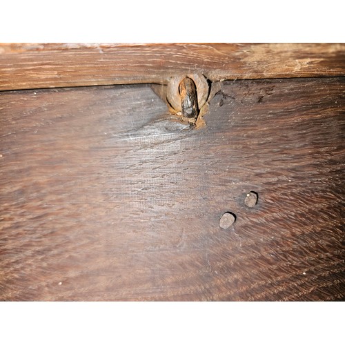 4009 - A circa 1780 pegged joined oak coffer, the split ring hinged top with internal candle/taper box over... 