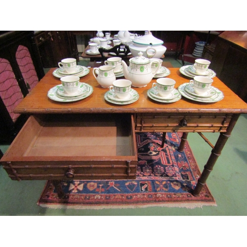 4069 - A Victorian Howard & Sons, Berners St. two drawer bamboo effect side table, marked to drawer, missin... 