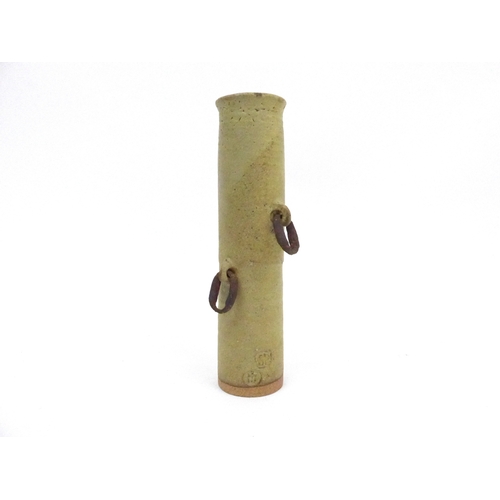 7141 - JOHN MALTBY (1936-2020) A Stoneshill pottery cylindrical vase with found iron loop handles. Impresse... 