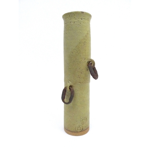 7141 - JOHN MALTBY (1936-2020) A Stoneshill pottery cylindrical vase with found iron loop handles. Impresse... 