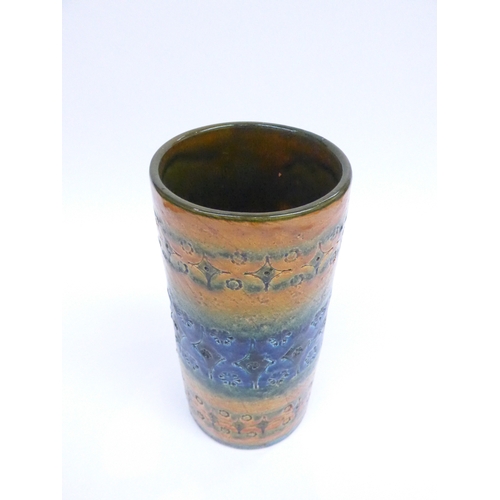 7004 - BITOSSI - An Italian pottery cylindrical vase, impressed motifs  under blue, yellow and green glazes... 