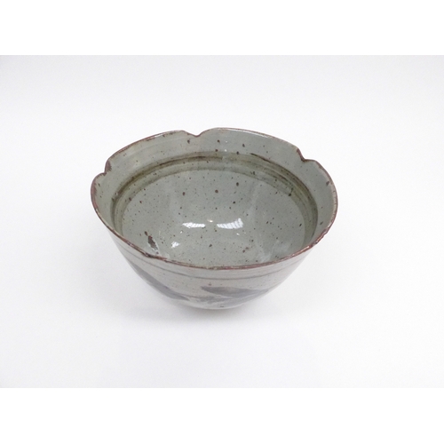 7045 - MILLY FINN (XX) A studio pottery bowl, ash glazes with painted leaf detail, label to base 11cm high ... 