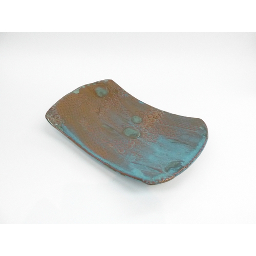 7126 - A studio pottery slab built dish with impressed motifs signed to base Kaori '99 33x21cm