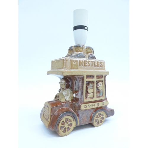 7079 - A Tremaen pottery lamp base in the form of a bus 25.5cm high including fitting