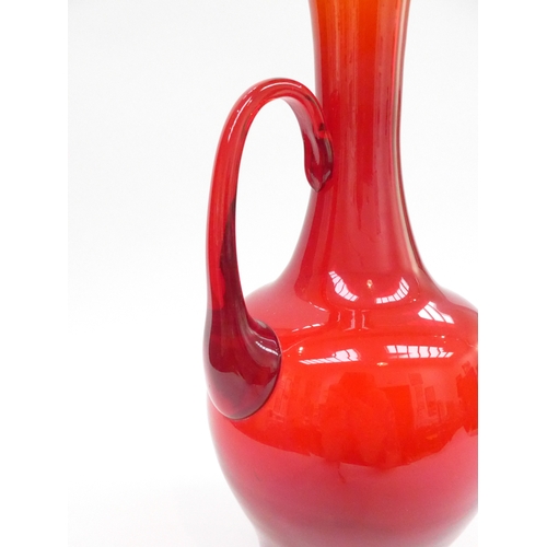 7240 - Attributed to Zebigniew Horobowy a red art glass pitcher with single handle. Polished pontil 37.5cm ... 