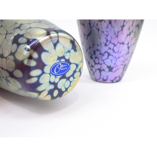 7323 - A pair of Okra art glass vases with mottled iridescent design. Labelled 22.5cm high