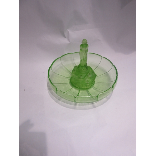 4445 - A green uranium glass fruit bowl and a green glass figure of a 1920's/30's female bather in swimsuit... 