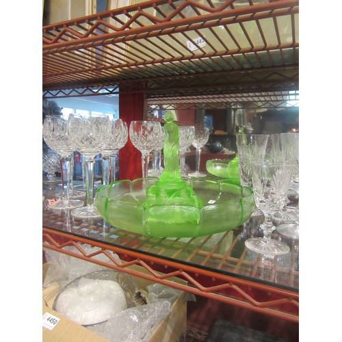 4445 - A green uranium glass fruit bowl and a green glass figure of a 1920's/30's female bather in swimsuit... 