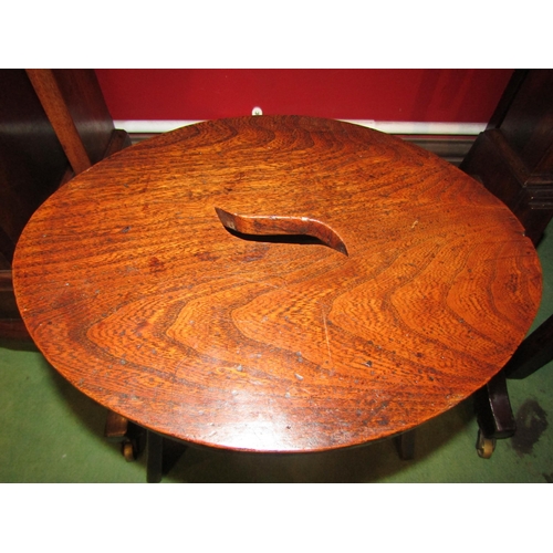 4046 - An 18th Century English elm stool with fret handled oval top on arched end leg supports, 35cm tall