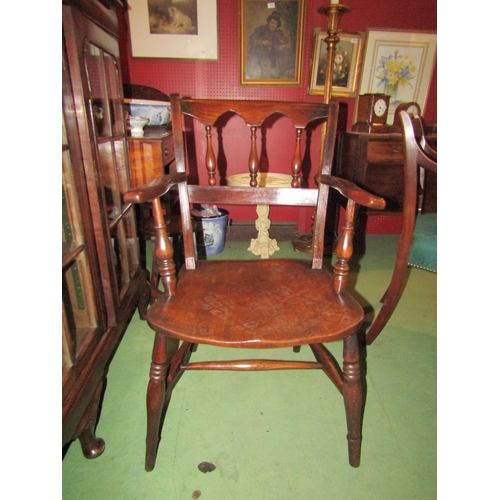 4062 - A circa 1860 elm and ash East Anglian armchair with turned spindles and arched shape backrest on tur... 