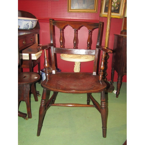 4062 - A circa 1860 elm and ash East Anglian armchair with turned spindles and arched shape backrest on tur... 