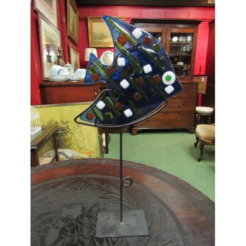 4105 - A candle stand as a blue glass fish, 44cm tall