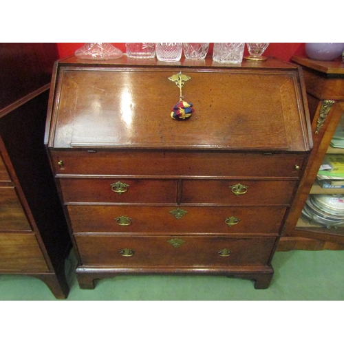 4143 - A George III country oak bureau, the fitted interior with document well over two short and two long ... 